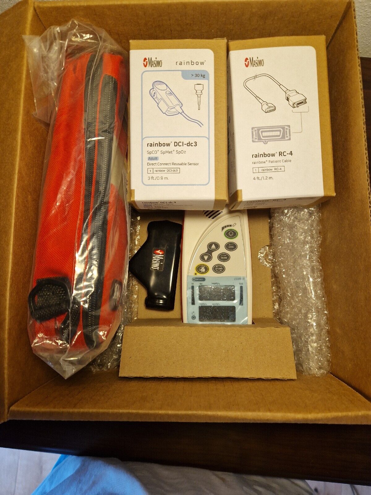 Masimo Rad-57 (SPO2, SPCO und SpMet) + Sensor, Kabeln, Hand-